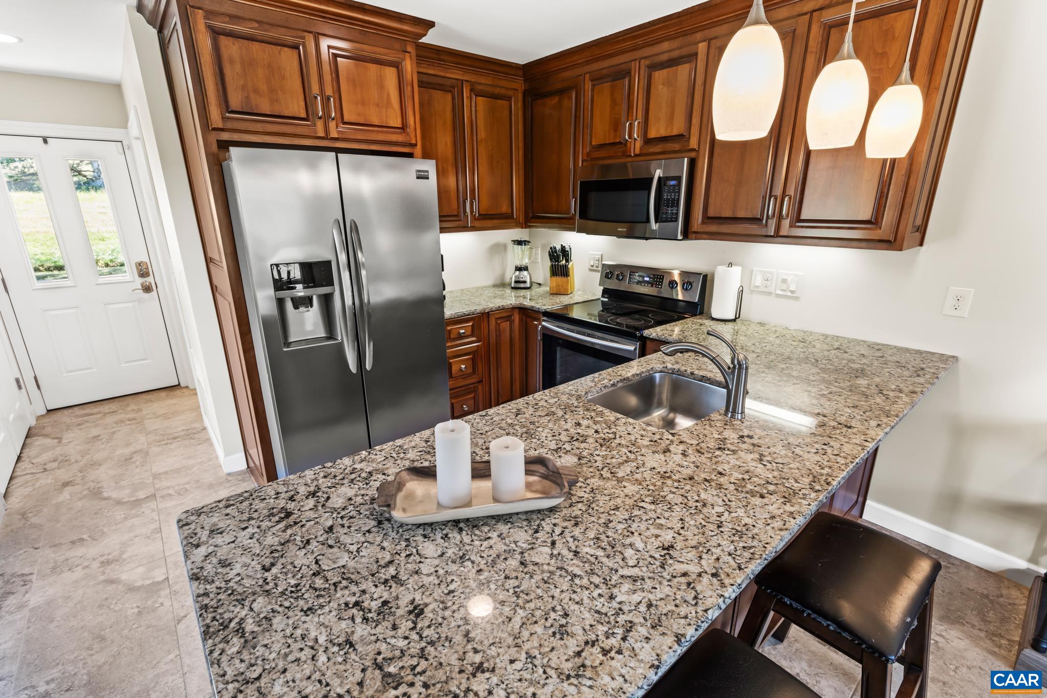 234 Creek Road Afton, VA 22920 - Photo 40 of 68 a kitchen with stainless steel appliances granite countertop a refrigerator a stove top oven a sink and dishwasher