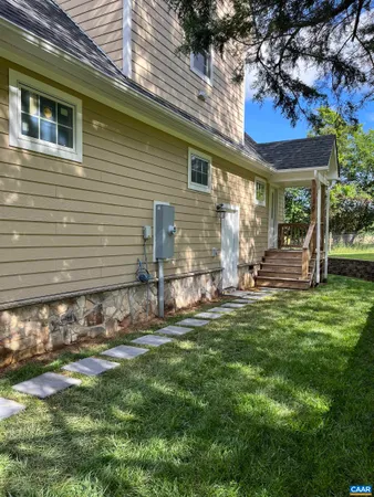a view of a yard with an outdoor space and seating area