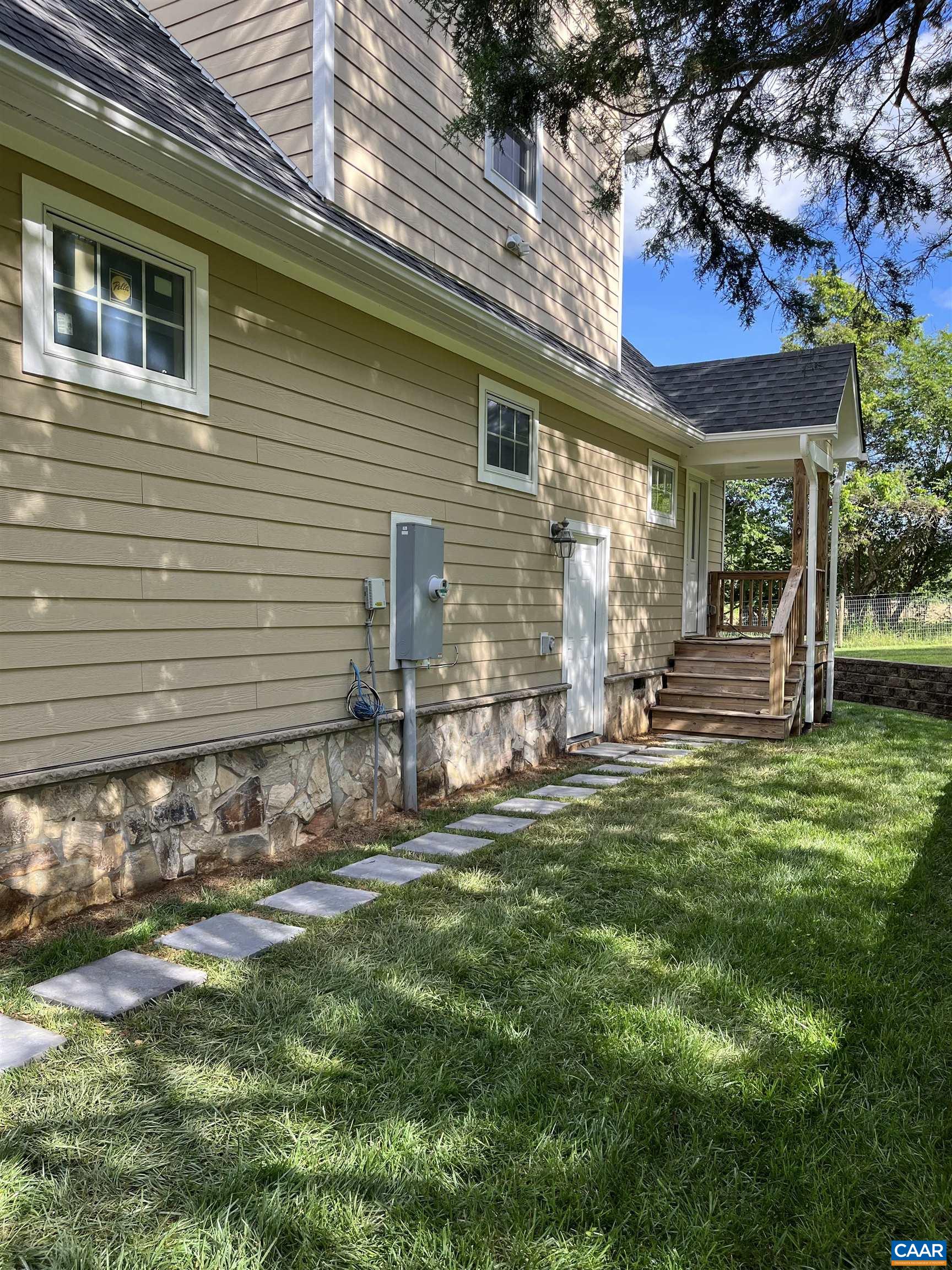 234 Creek Road Afton, VA 22920 - Photo 46 of 68 a view of a house with backyard and sitting area