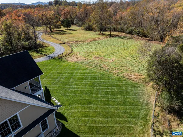 a view of a house with a big yard