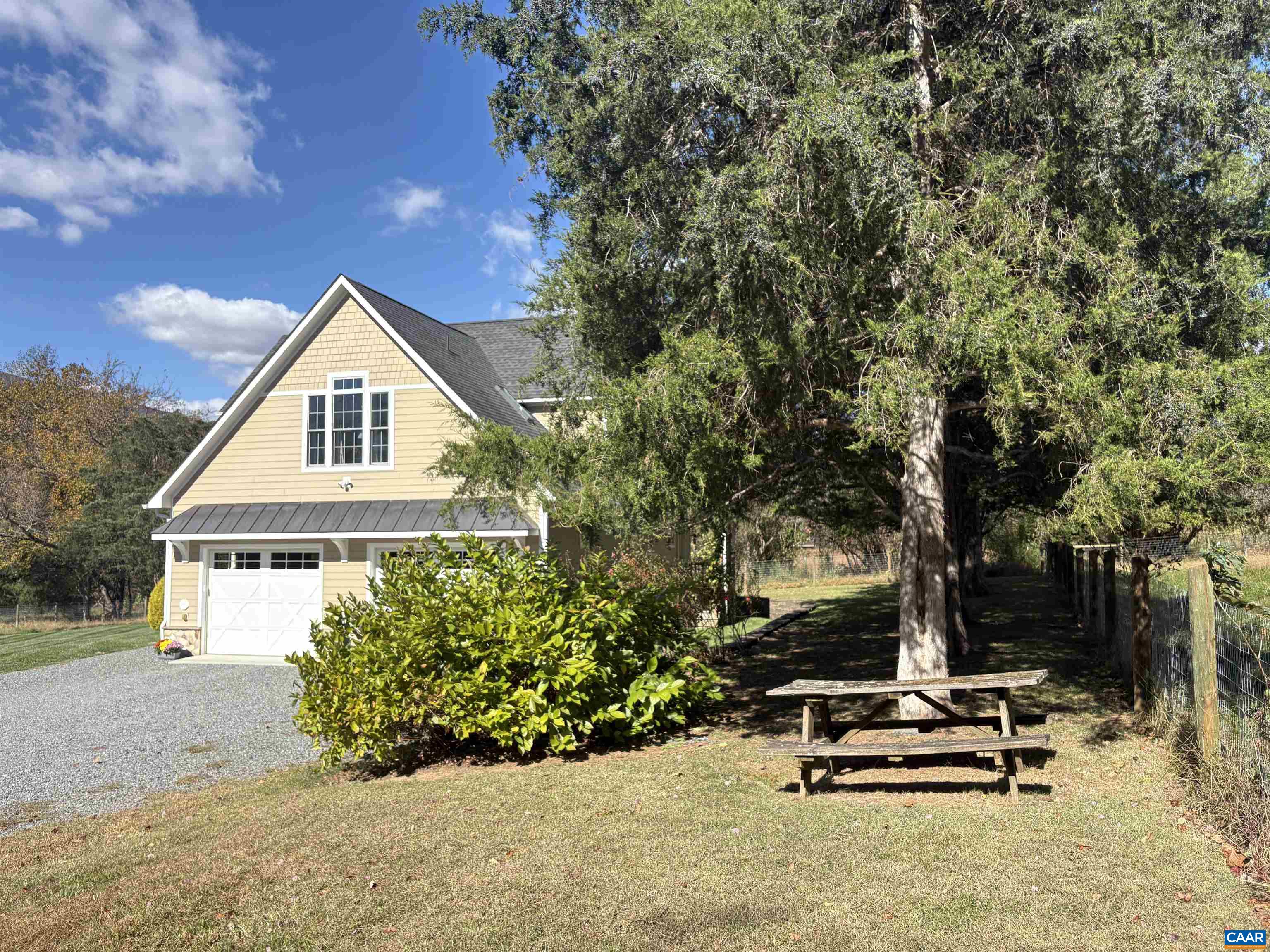 234 Creek Road Afton, VA 22920 - Photo 51 of 68 a view of a house with a backyard and sitting area