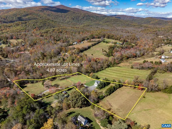 a view of a two chairs in the balcony