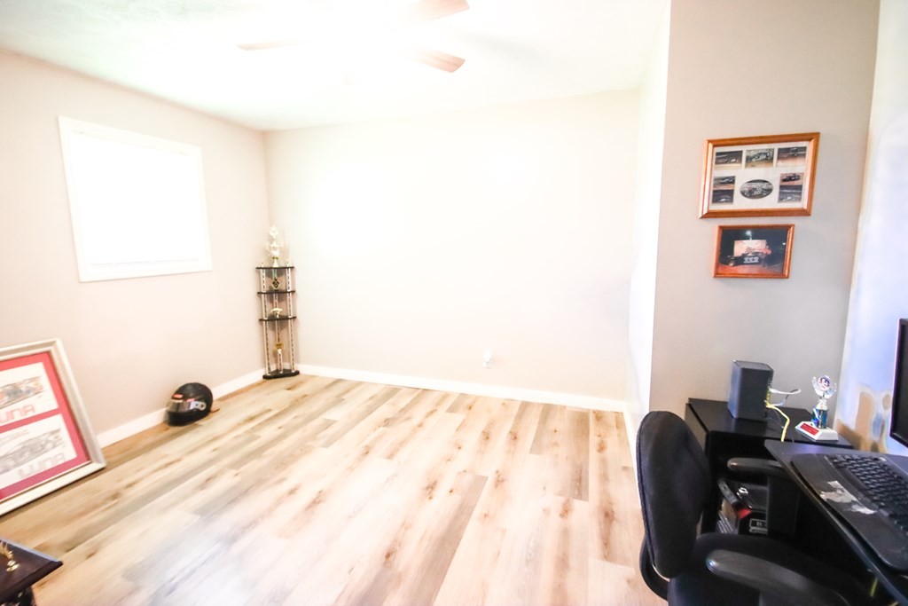 131 Collingwood Road Walling, TN 38587 - Photo 17 of 26 a bedroom with a bed and a couch