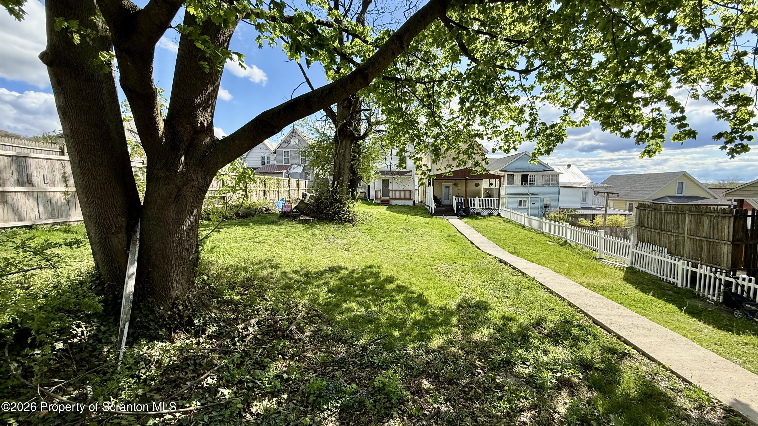 1032 Chestnut Street Sunbury, PA 17801 - Photo 19 of 25 a view of swimming pool with a patio and a yard