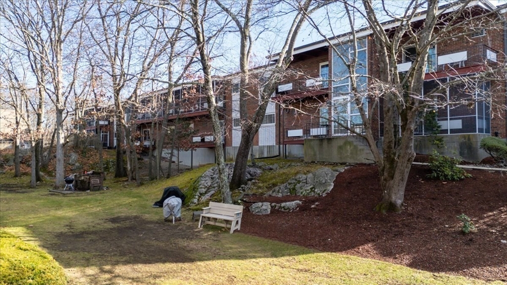 115 Grove Street, Unit 11 Boston, MA 02132 - Photo 24 of 29 a view of a park with large trees