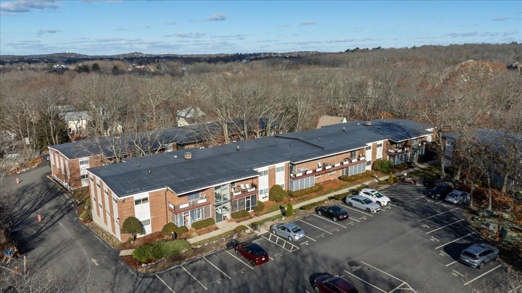 115 Grove Street, Unit 11 Boston, MA 02132 - Photo 28 of 29 a view of a terrace with a lake