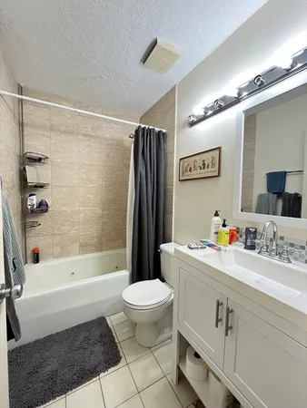 a bathroom with a sink a toilet and a bathtub