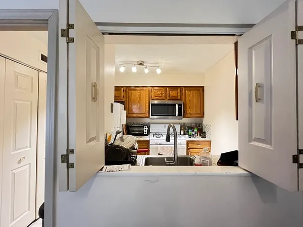 a view of living room with furniture and a flat screen tv