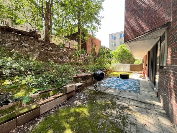 a view of house with backyard