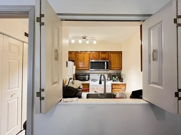a view of living room with furniture and a flat screen tv