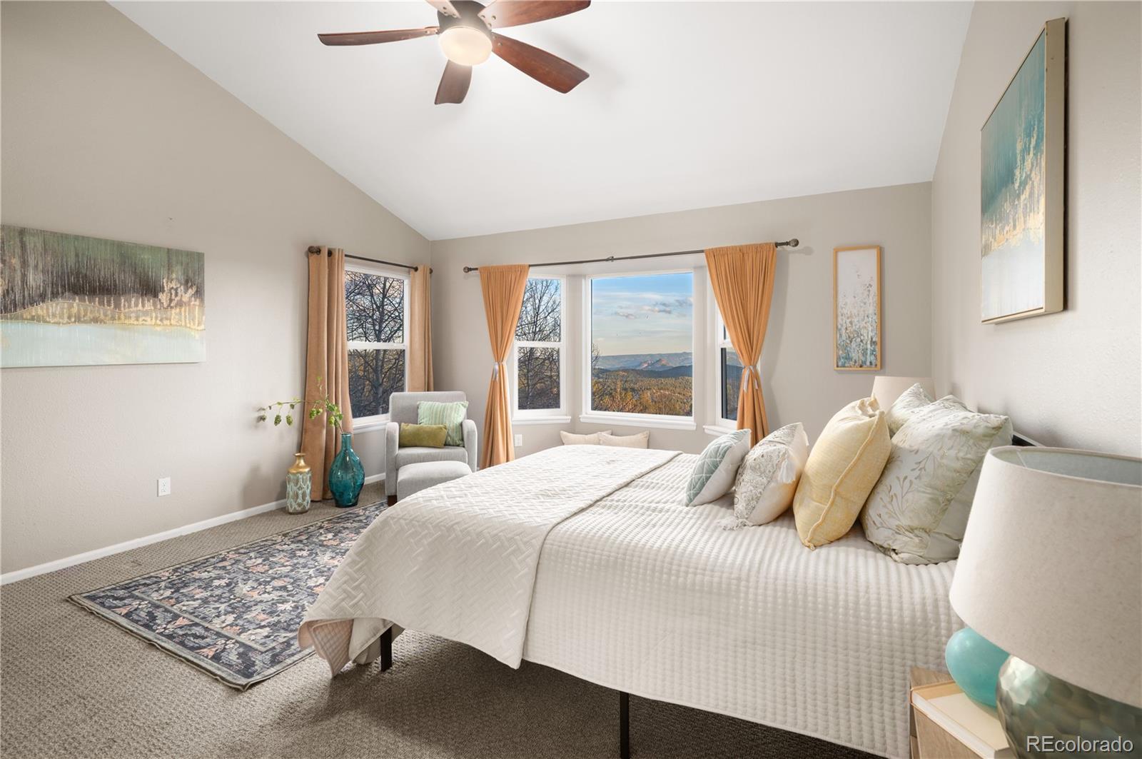11740 Baca Road Conifer, CO 80433 - Photo 34 of 49 a bedroom with a large bed and a window