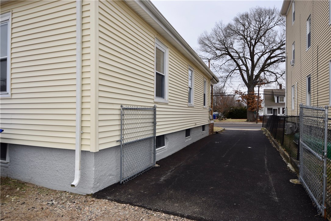 476 Power Road Pawtucket, RI 02860 - Photo 4 of 11 Oversized new asphalt driveway.
