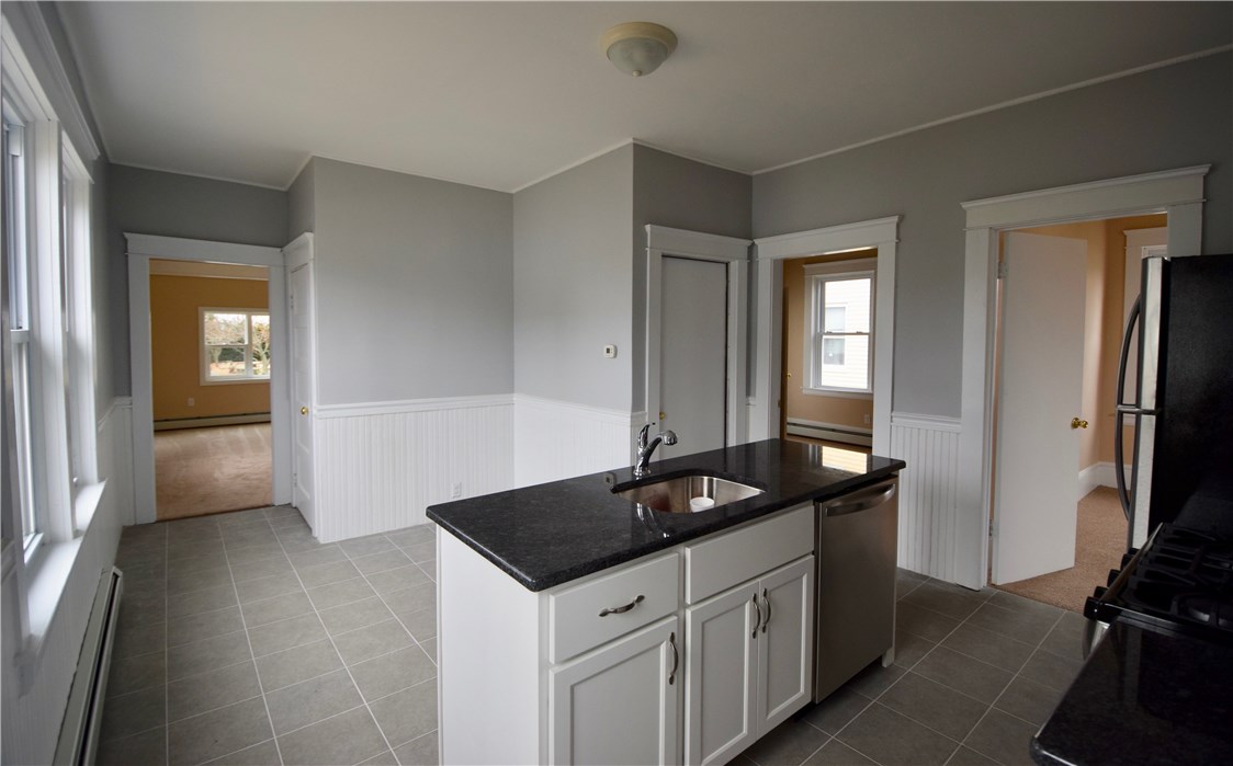 476 Power Road Pawtucket, RI 02860 - Photo 6 of 11 Kitchen view into living room.