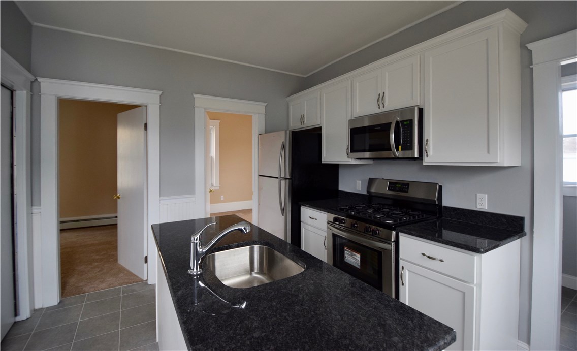 476 Power Road Pawtucket, RI 02860 - Photo 7 of 11 Kitchen view into bedrooms.