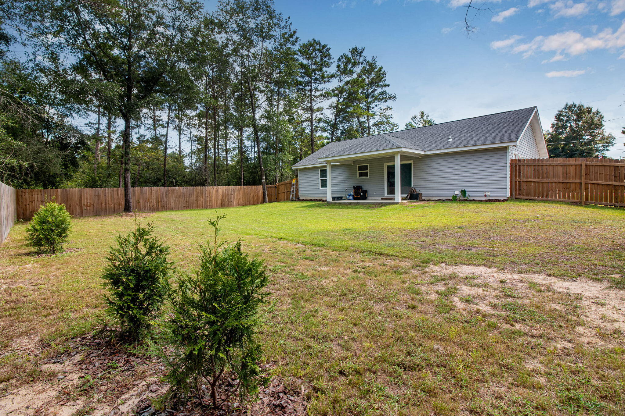 43 Crocus Avenue DeFuniak Springs, FL 32433 - Photo 20 of 20 a view of a house with a yard and large trees