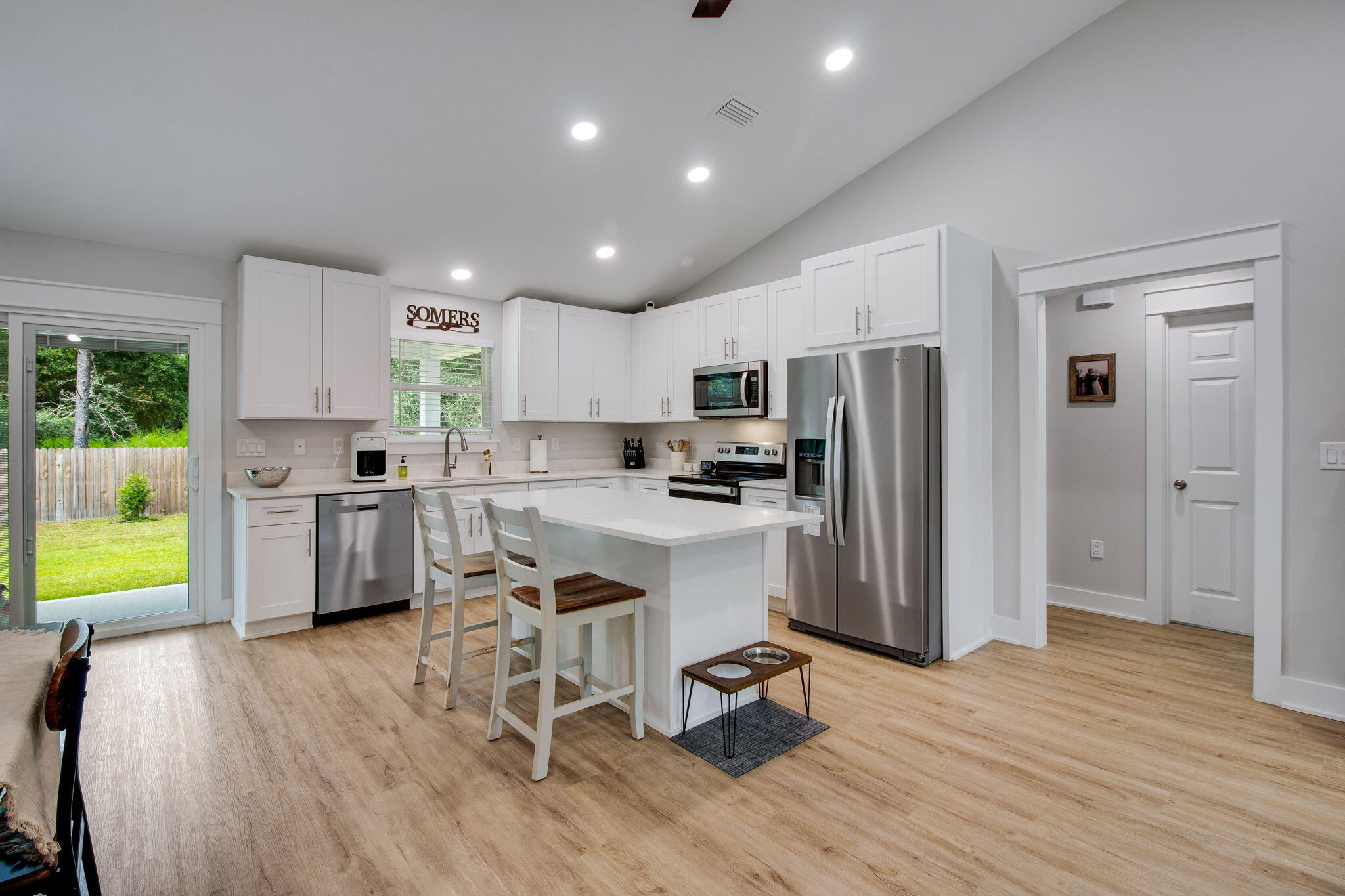 43 Crocus Avenue DeFuniak Springs, FL 32433 - Photo 6 of 20 a kitchen with a sink a counter top space stainless steel appliances and cabinets