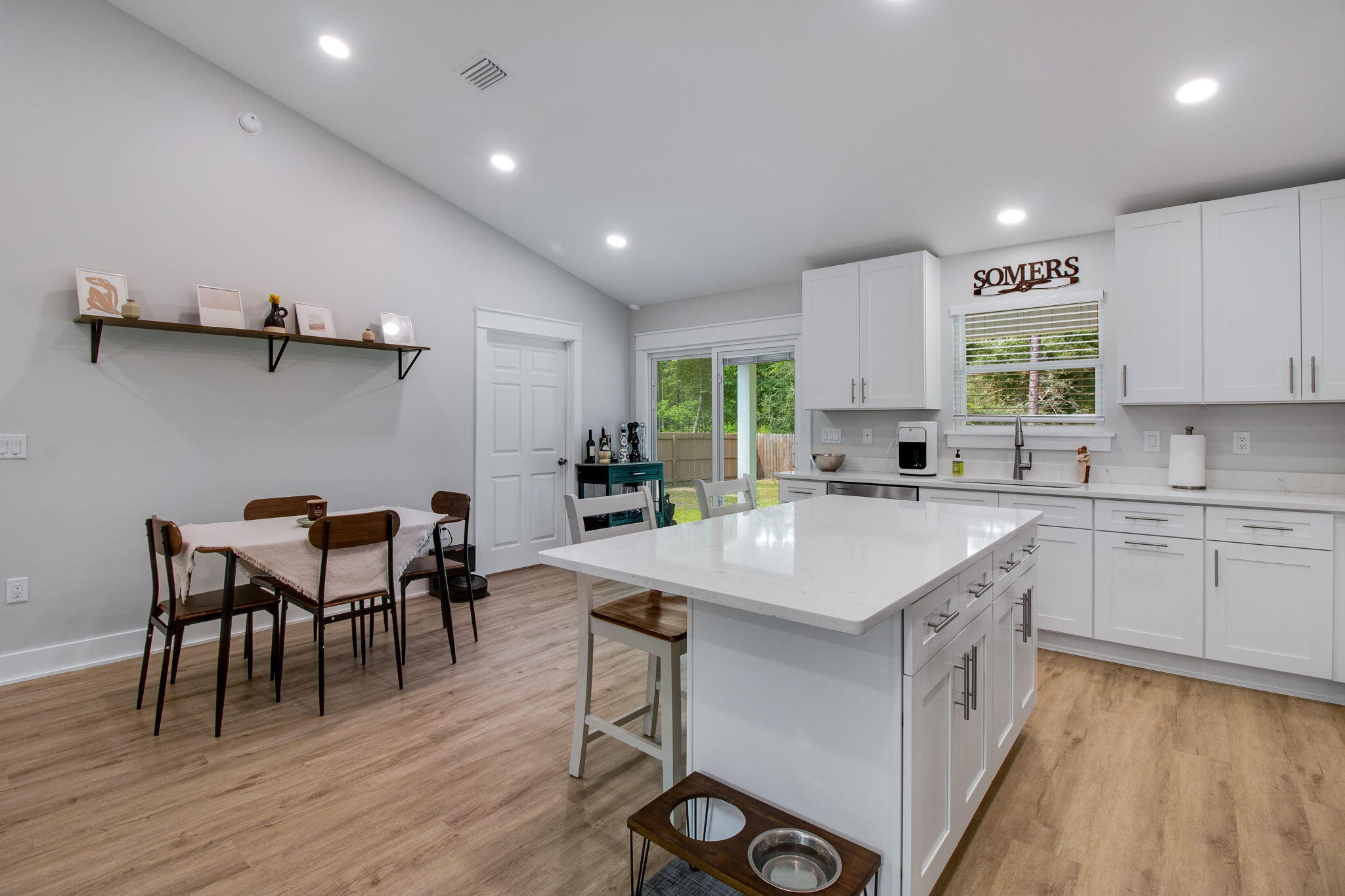 43 Crocus Avenue DeFuniak Springs, FL 32433 - Photo 8 of 20 a kitchen with a table chairs sink and cabinets