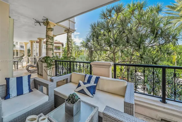 a view of a swimming pool with a patio and a yard