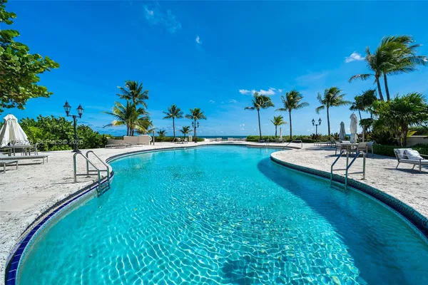 a view of a swimming pool with a sitting space
