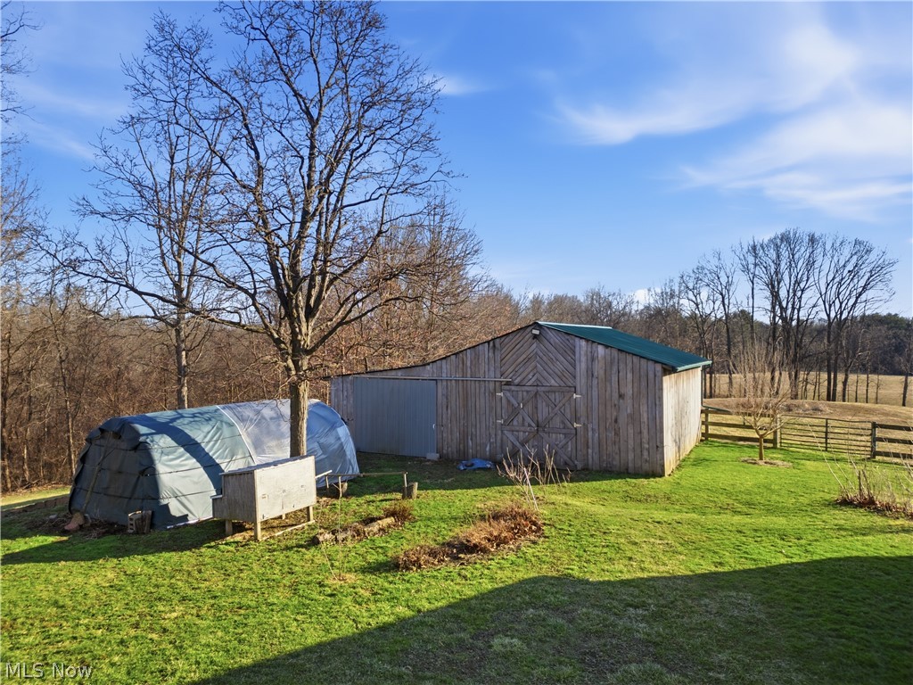 52450 Tower Road Cumberland, OH 43732 - Photo 31 of 41 View of yard featuring an outdoor structure and a barn