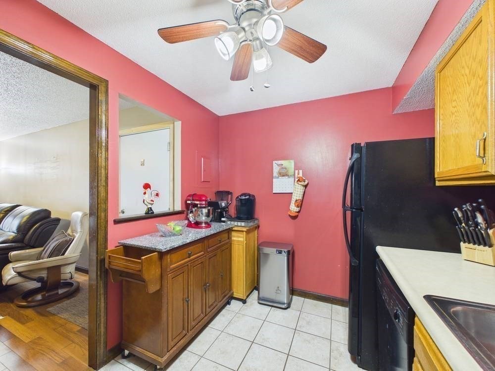 1940 Phillips Road, Unit 17 New Bedford, MA 02745 - Photo 11 of 18 a bedroom with a bed and a dresser