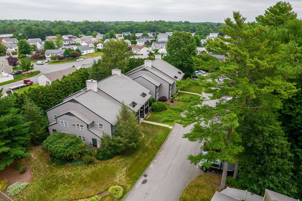 1940 Phillips Road, Unit 17 New Bedford, MA 02745 - Photo 4 of 18 an aerial view of a house with a garden