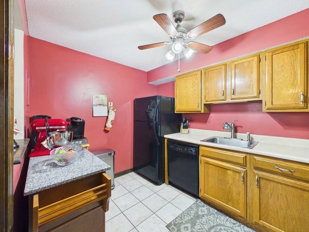 1940 Phillips Road, Unit 17 New Bedford, MA 02745 - Photo 10 of 18 a kitchen with a sink stove and refrigerator