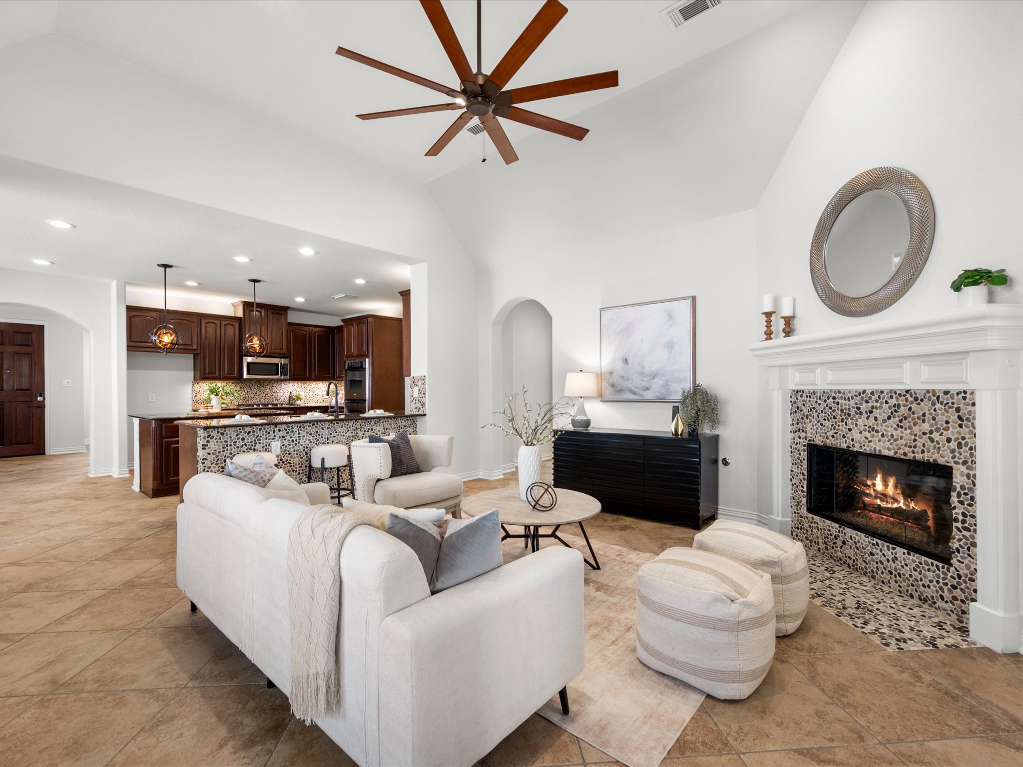 323 Arbor Ridge Lane Conroe, TX 77384 - Photo 15 of 40 Every angle of this room works. Tons of natural light, easy flow to the backyard, and that vaulted ceiling makes it feel twice the size. Living made easy.