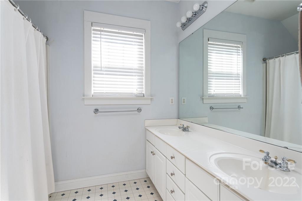 8110 Strandhill Road Huntersville, NC 28078 - Photo 18 of 23 a bathroom with a sink a mirror and a shower