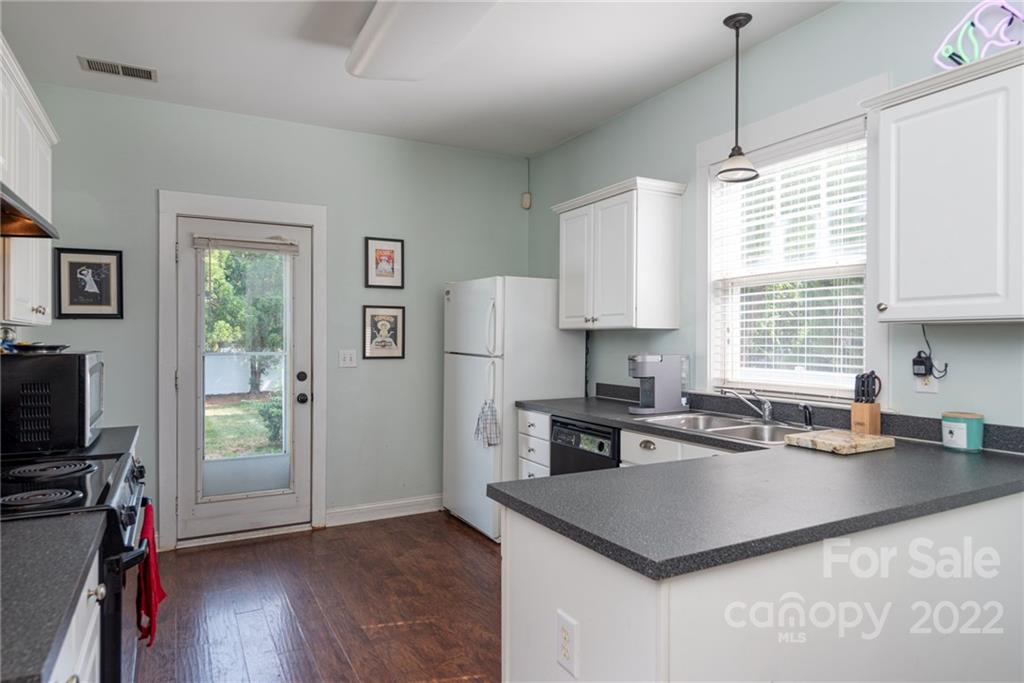 8110 Strandhill Road Huntersville, NC 28078 - Photo 10 of 23 a kitchen that has a cabinets counter space and a window