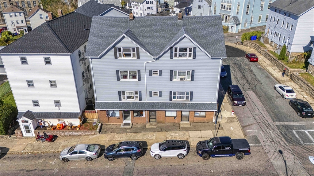 an aerial view of a house with parking space