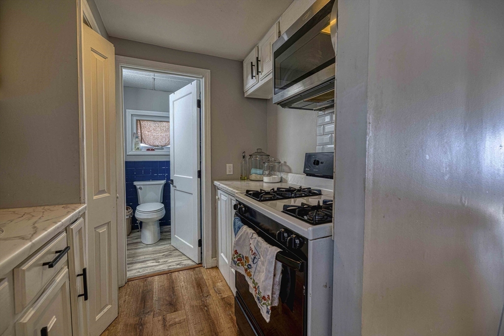 1273-1279 South Main Street Fall River, MA 02724 - Photo 12 of 33 a kitchen with a stove and a refrigerator