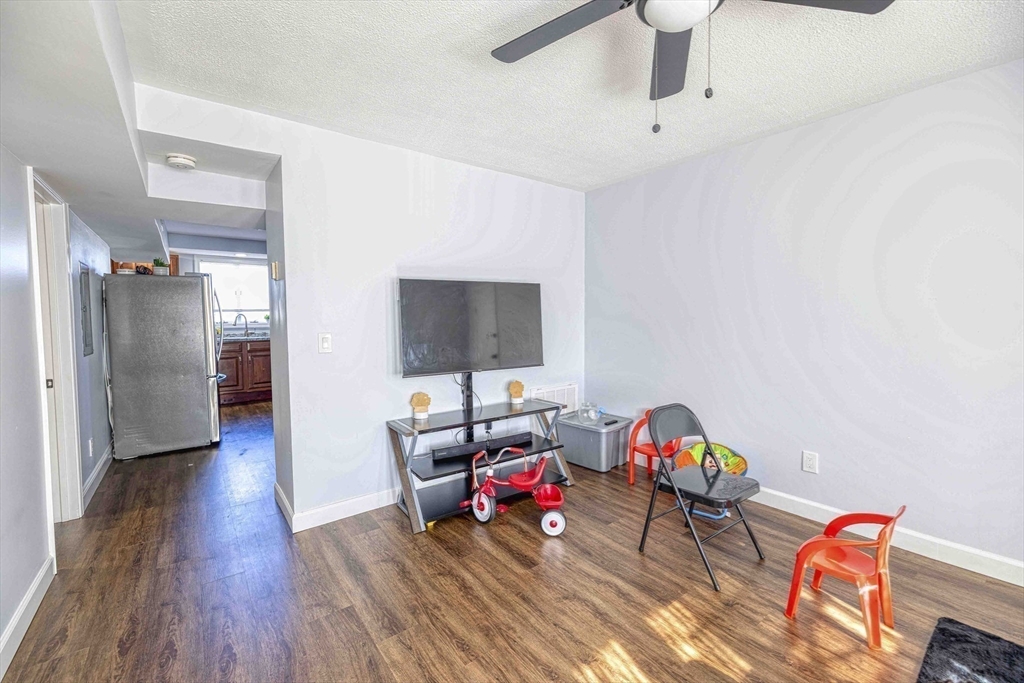 1273-1279 South Main Street Fall River, MA 02724 - Photo 14 of 33 a living room with furniture and a flat screen tv