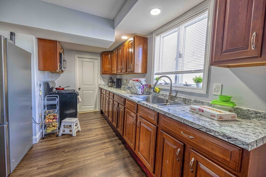 1273-1279 South Main Street Fall River, MA 02724 - Photo 16 of 33 a kitchen with granite countertop lots of counter top space and stainless steel appliances
