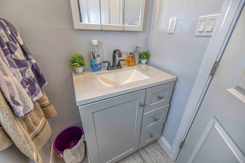 1273-1279 South Main Street Fall River, MA 02724 - Photo 18 of 33 a bathroom with a sink and a mirror