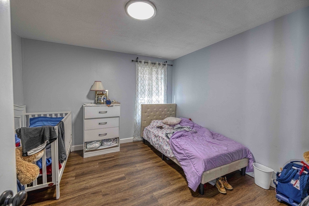 1273-1279 South Main Street Fall River, MA 02724 - Photo 20 of 33 a bedroom with a bed and a closet