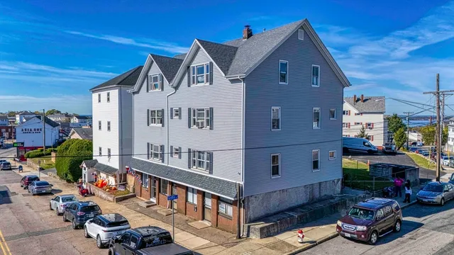 a view of multiple houses with a street