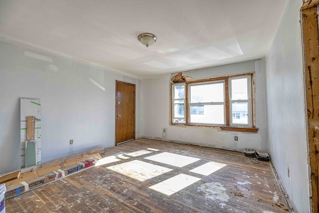 1273-1279 South Main Street Fall River, MA 02724 - Photo 28 of 33 a view of empty room with wooden floor and fan