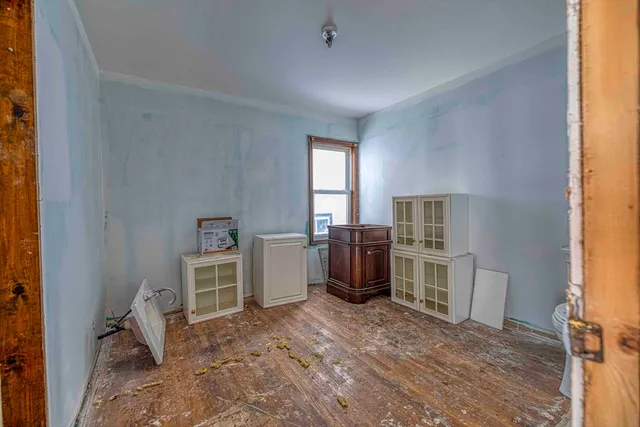 a bed room with a bed and a window