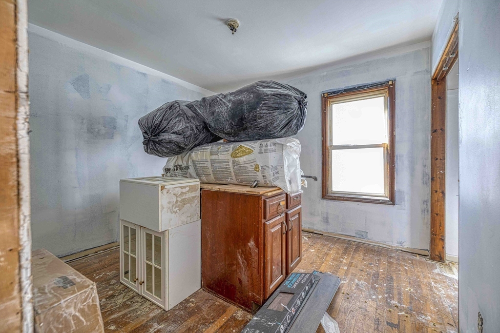 1273-1279 South Main Street Fall River, MA 02724 - Photo 30 of 33 a bed room with a bed and a window