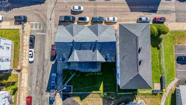 an aerial view of multiple houses with outdoor space