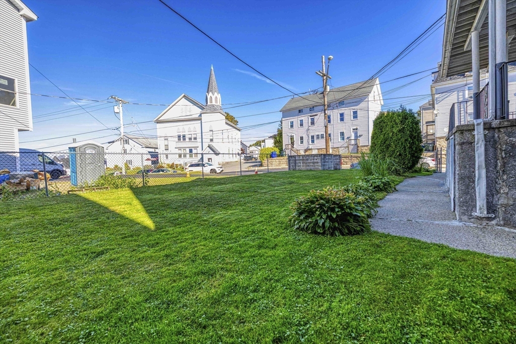 1273-1279 South Main Street Fall River, MA 02724 - Photo 4 of 33 a view of a house with a yard and porch