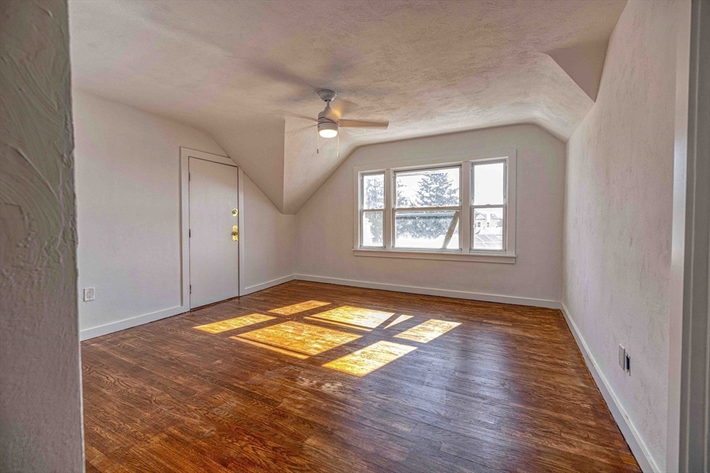 1273-1279 South Main Street Fall River, MA 02724 - Photo 7 of 33 a view of empty room with window and wooden floor