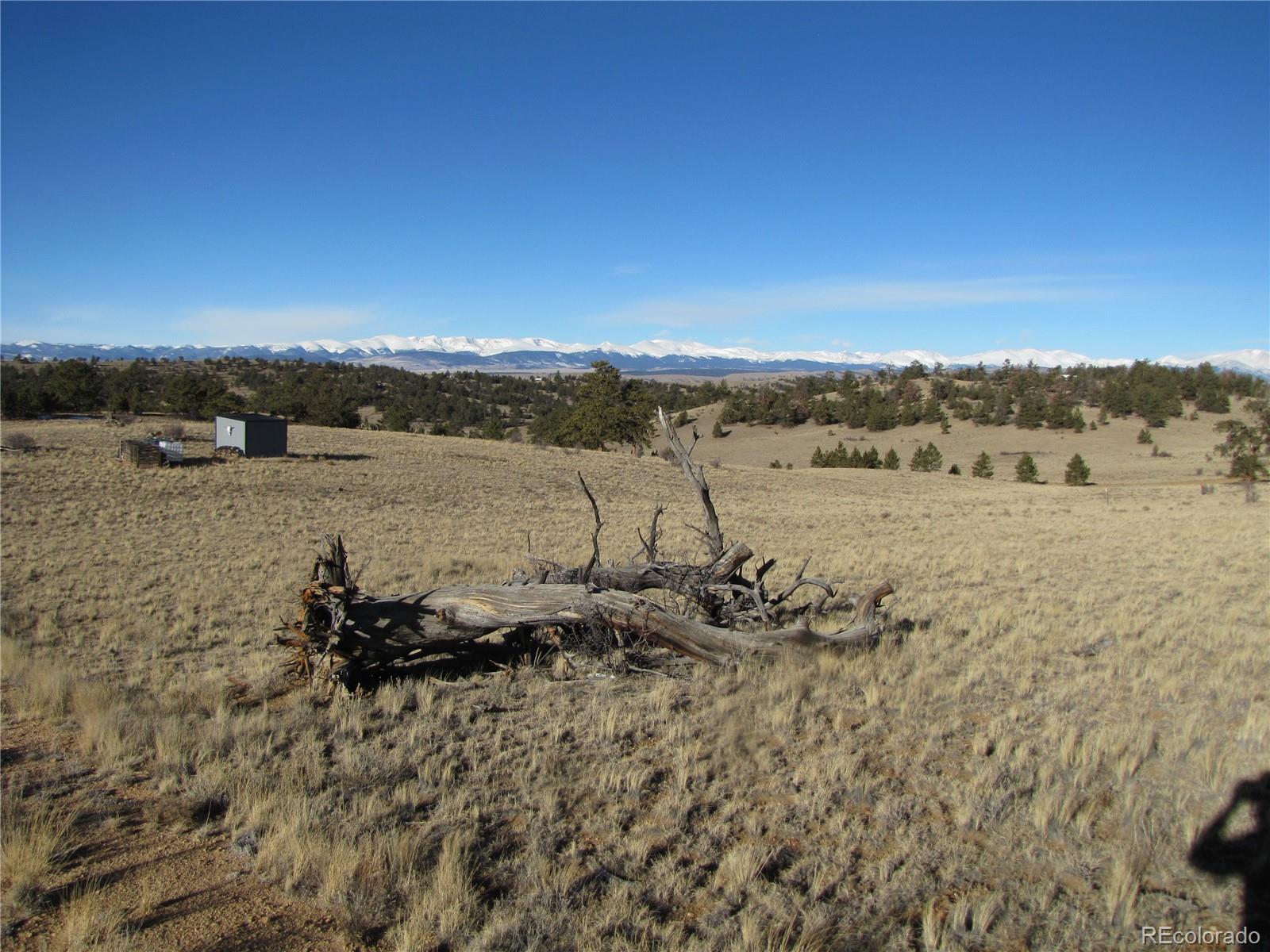 2767 Fitzsimmons Road Hartsel, CO 80449 - Photo 6 of 28 a view of a lake with mountain