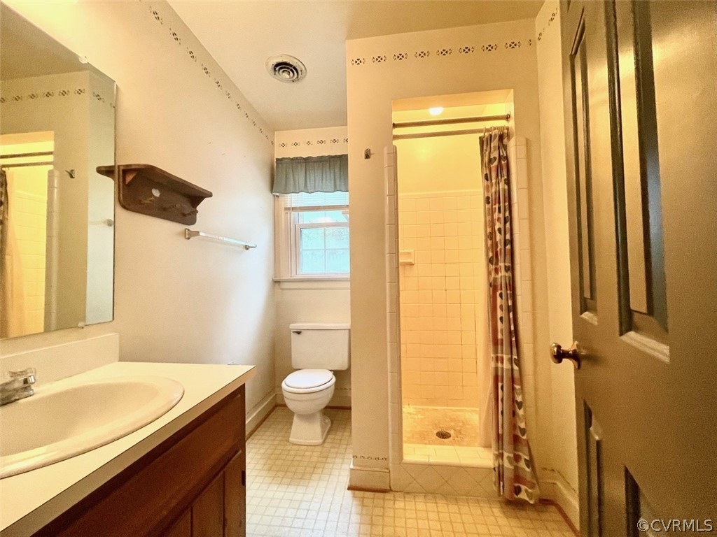 1200 Mapleton Circle Henrico, VA 23229 - Photo 16 of 20 a bathroom with a granite countertop sink toilet and shower