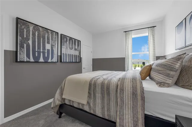 a bedroom with a bed and window