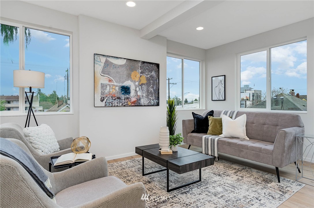 941 North 91st Street, Unit B Seattle, WA 98103 - Photo 12 of 23 a living room with furniture and a large window