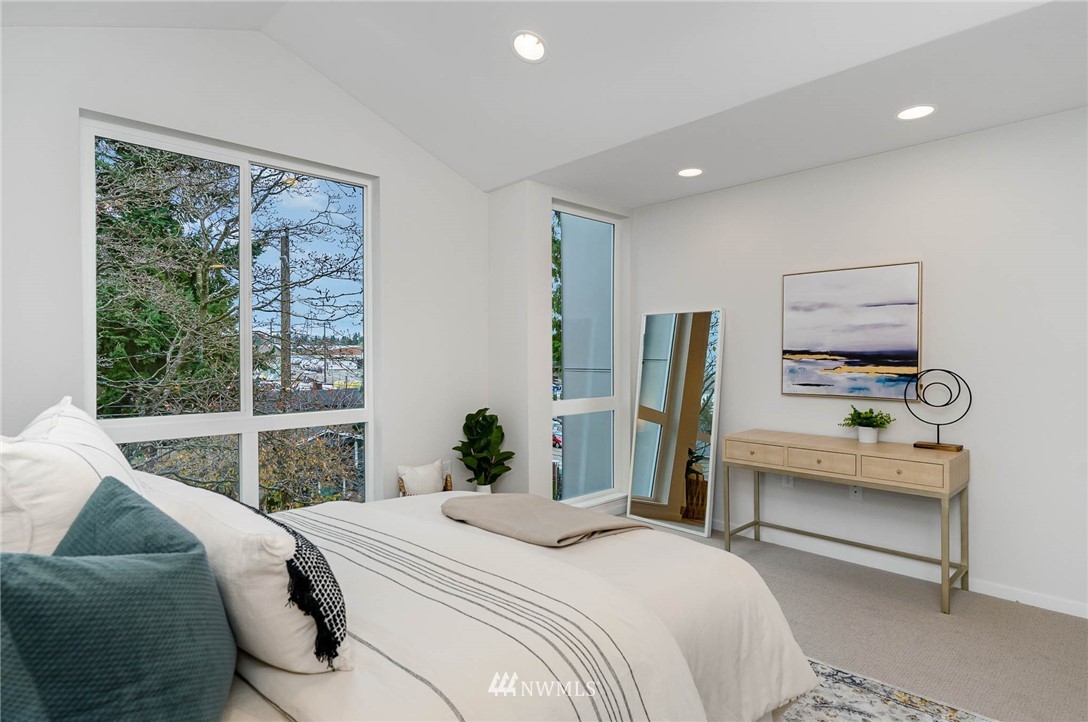 941 North 91st Street, Unit B Seattle, WA 98103 - Photo 17 of 23 a bedroom with a bed and a window