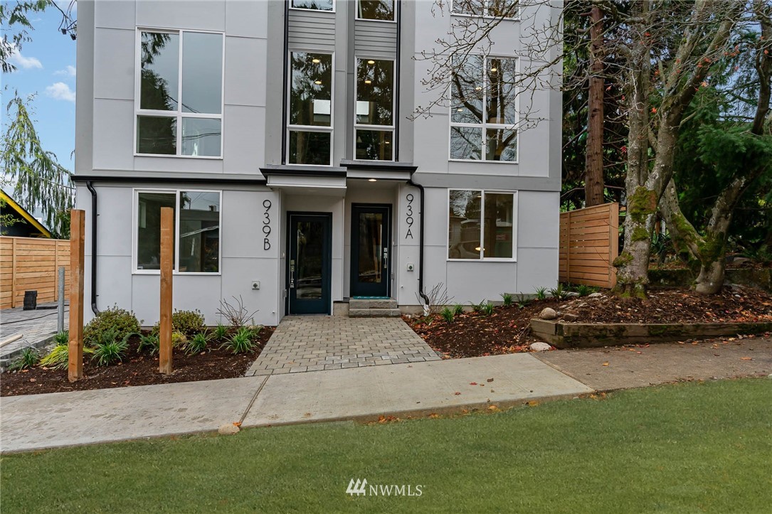 941 North 91st Street, Unit B Seattle, WA 98103 - Photo 22 of 23 a front view of a house with a yard