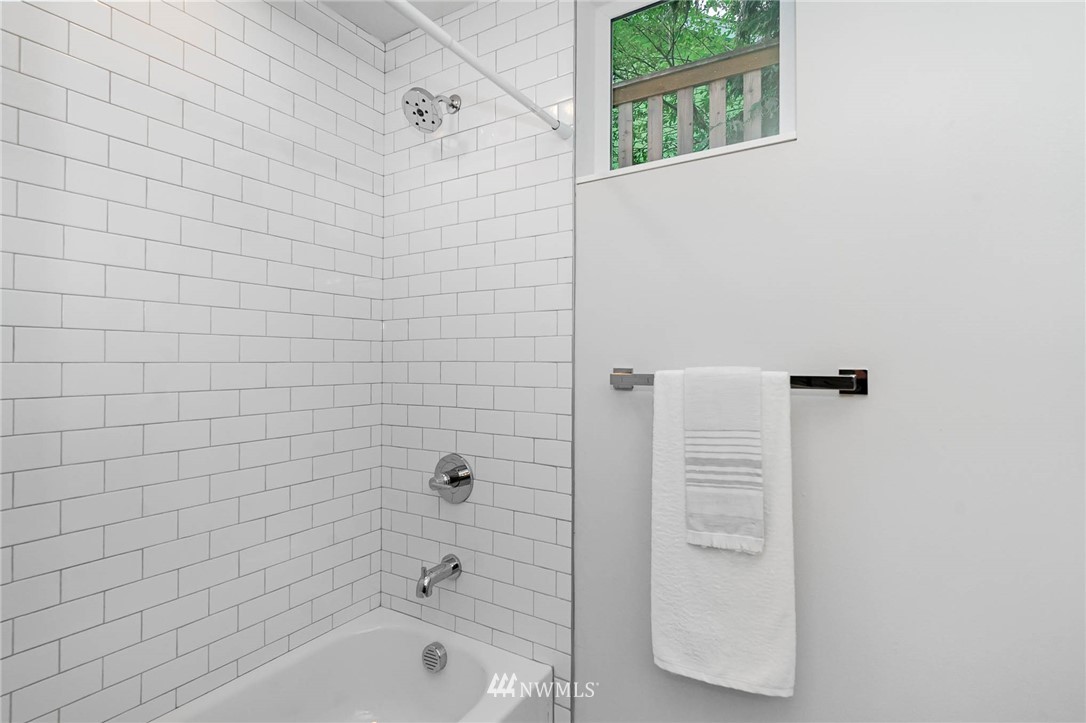 941 North 91st Street, Unit B Seattle, WA 98103 - Photo 7 of 23 a bathroom with a bathtub